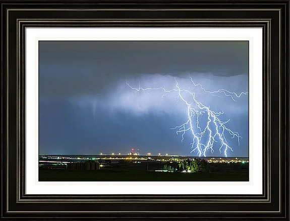Northeast Colorado Lightning Strike And City Lights Framed Print