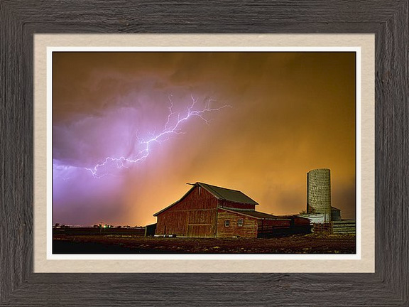 Watching The Storm From The Farm Framed Print