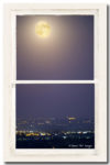Super Moon Over City Lights View Through White Rustic Window